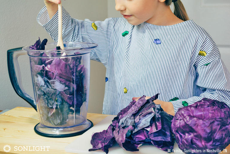 Use scissors to cut up the leaves, then place all the pieces in the blender. 