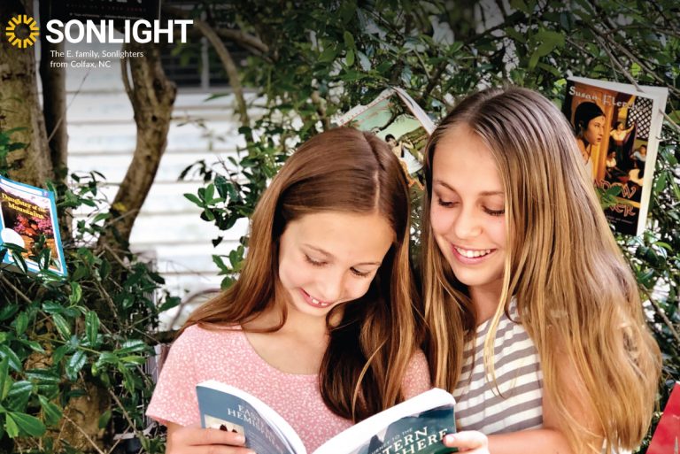 Two sisters share a book