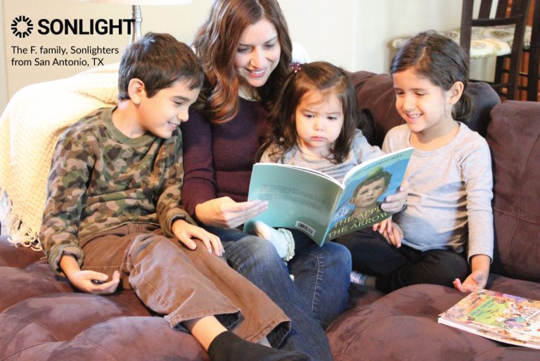 mom reads to three children