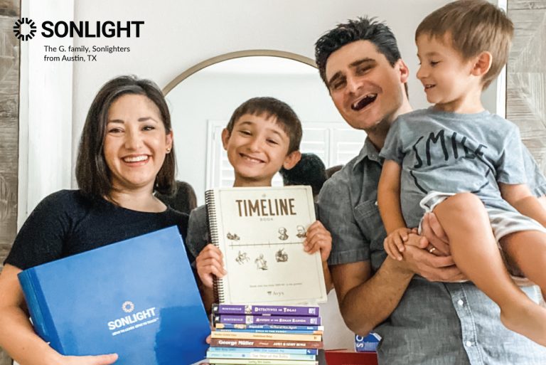 happy family shows off their Sonlight curriculum after switching from public school to homeschool