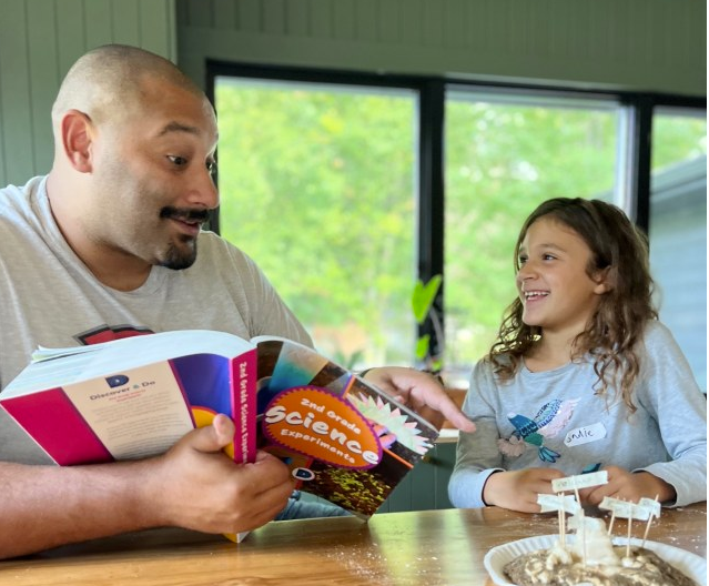 Science for kids | Sonlight dad completing a beautiful diagram of how water with his daughter